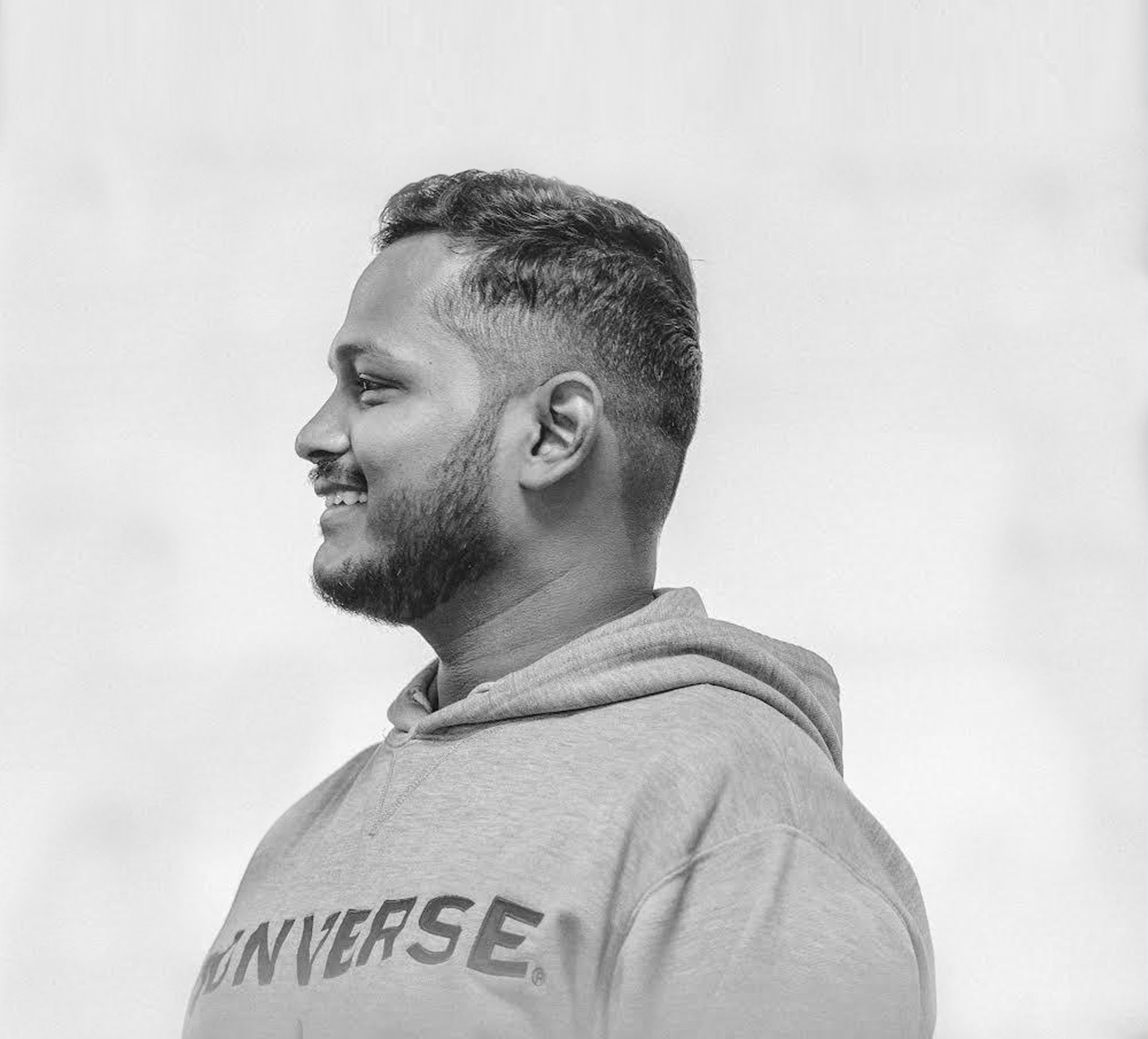 Tejj smiling in profile