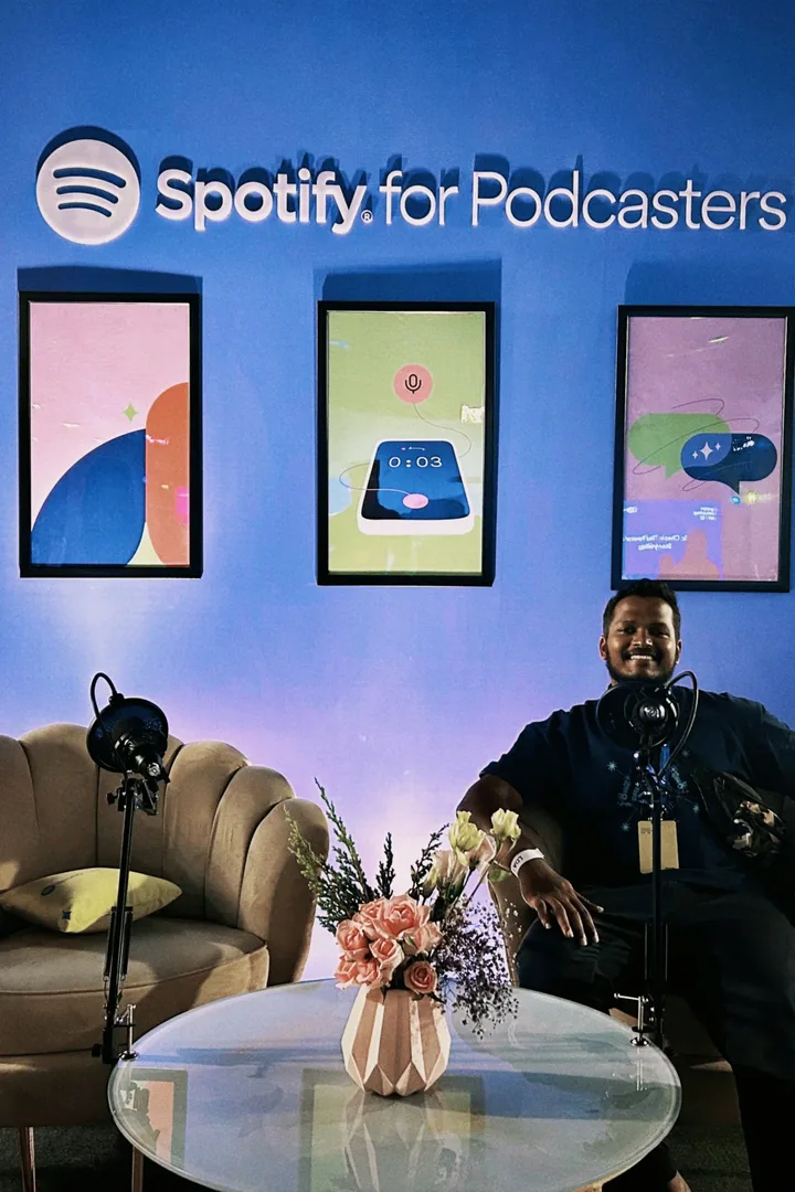 Tejj at Spotify for Podcasters with recording microphones