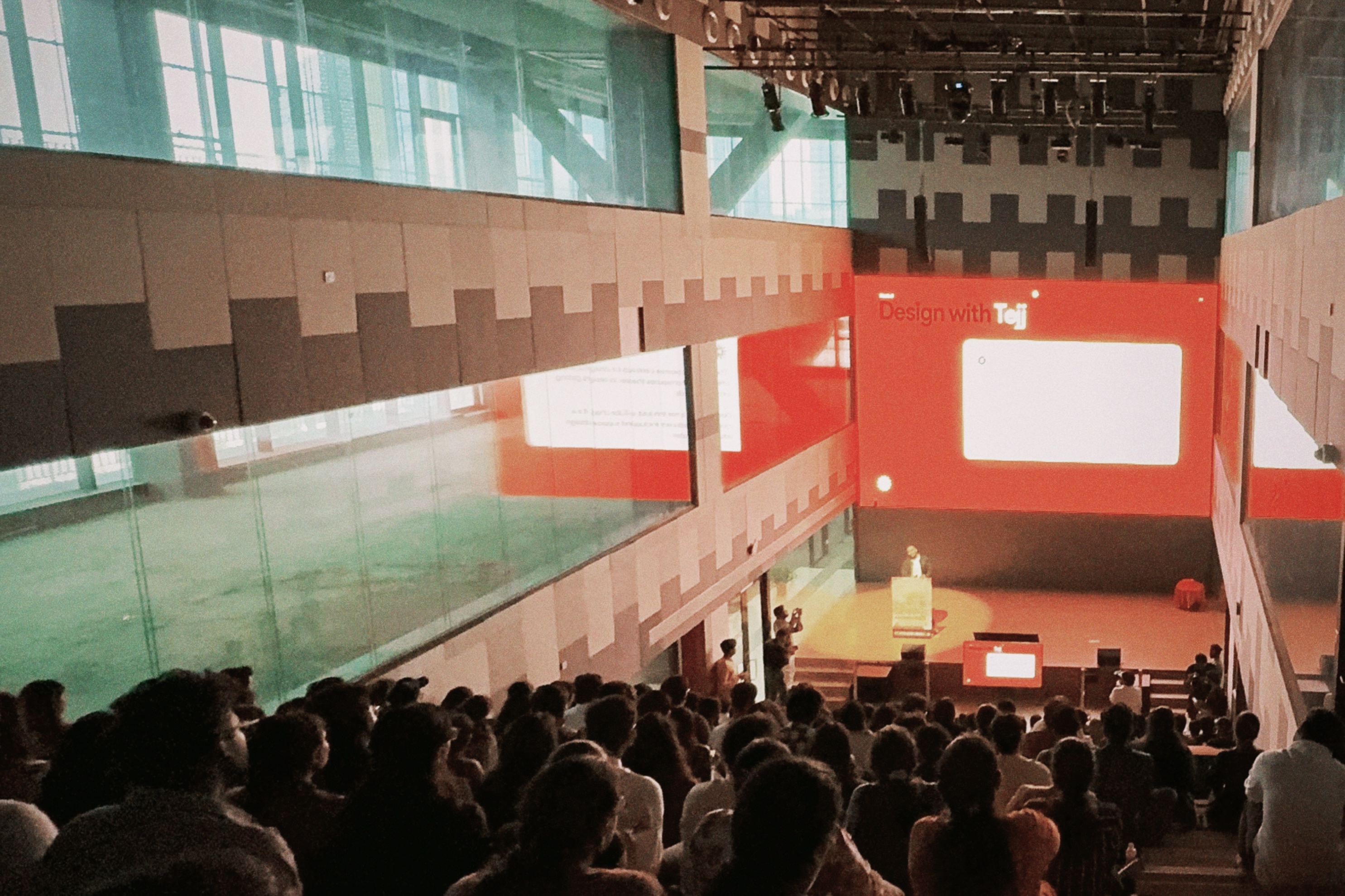 Tejj, Product Designer at Microsoft AI, delivering a keynote talk at a design conference