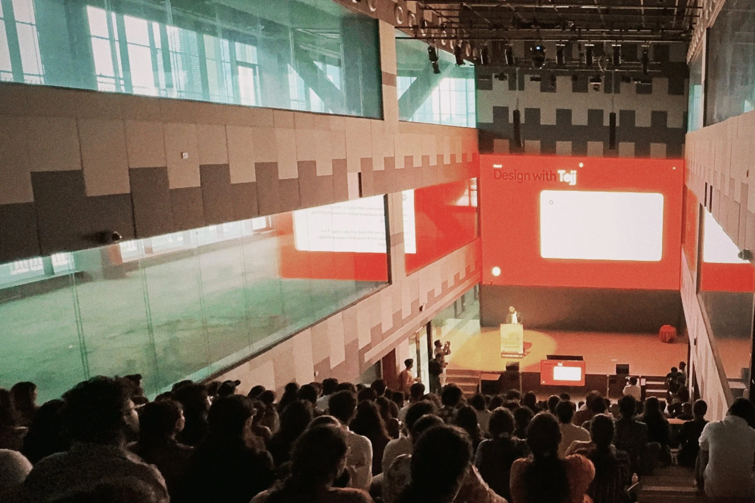 Tejj, Product Designer at Microsoft AI, delivering a keynote talk at a design conference