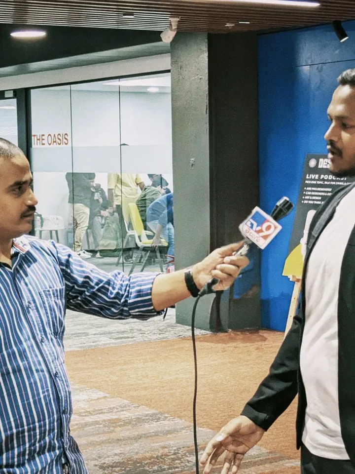 Tejj being interviewed by press at the Nodes of Wisdom launch